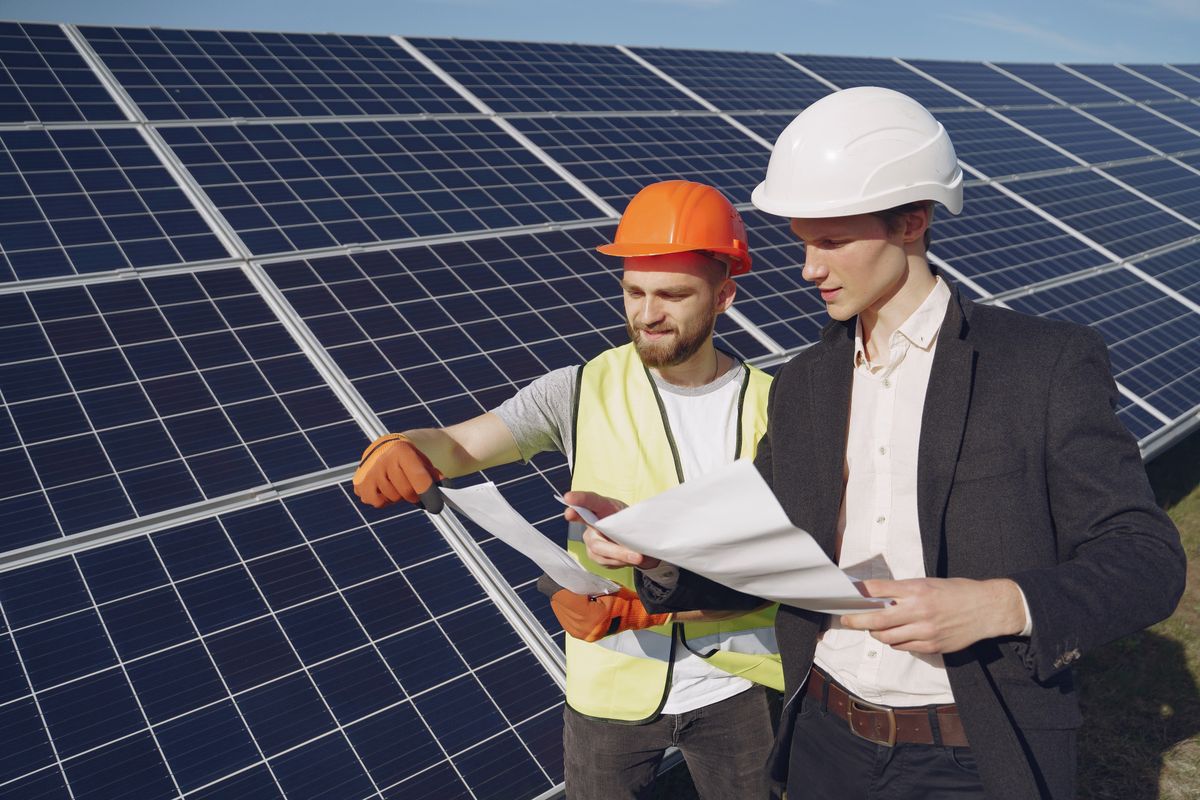 Home foreman and businessman at solar energy station.